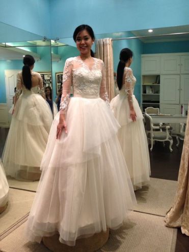 Wedding ball gown with a full tulle skirt and a lace bodice.